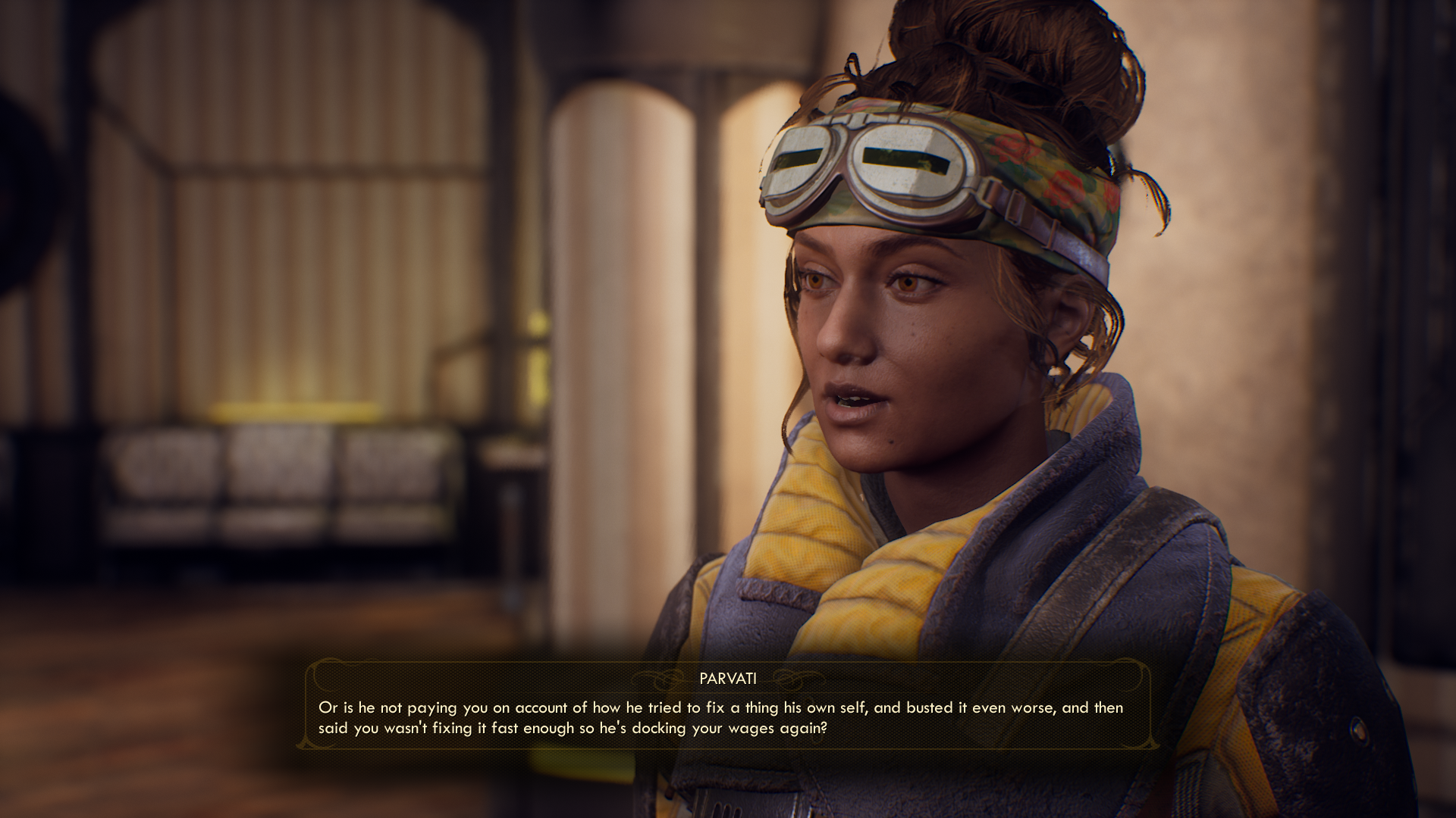 A woman, Parvati, with brown hair tied back and slit goggles on her head, complaining about her boss